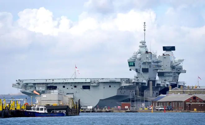 Royal Navy aircraft carrier HMS Prince of Wales moored in Portsmouth Harbour after its scheduled sailing was called off at the last minute after an 'issue' was found in final checks with the starboard propeller coupling.
