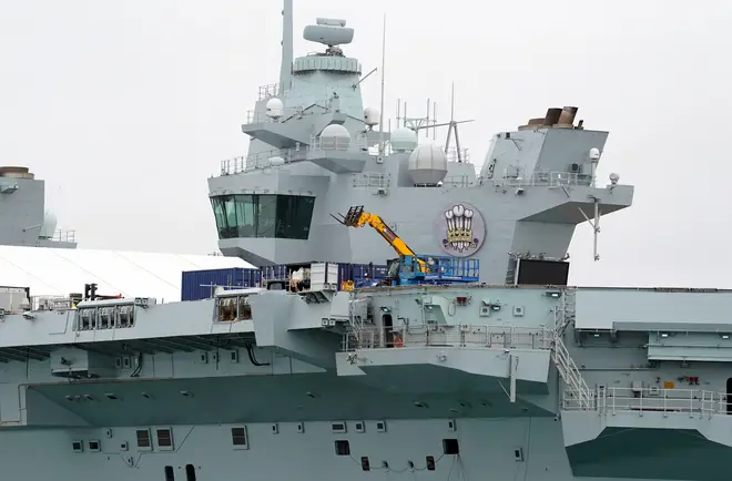 Work is undertaken on the flight deck of the Royal Navy aircraft carrier HMS Prince of Wales alongside at HMNB Portsmouth.