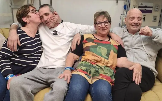 L-R: Gabriela Leimberg kisses her brother Fernando Marman, Clara Marman next to her partner Louis Har, at the Sheba Medical Center