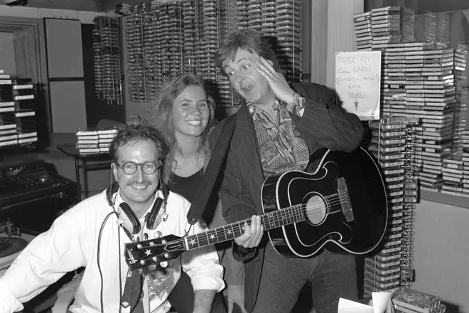 Paul McCartney surprising Steve Wright (left) and his production assistant Dianne Oxberry in June 1990