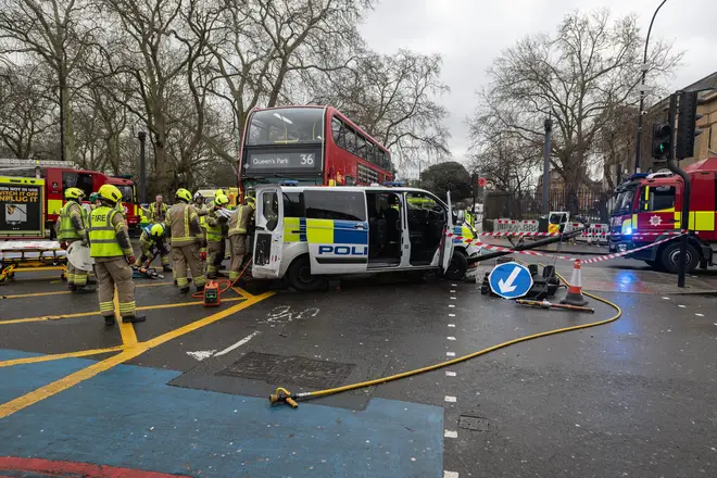mergency services attend the scene at Kennington in South London after a police van collided with a bus