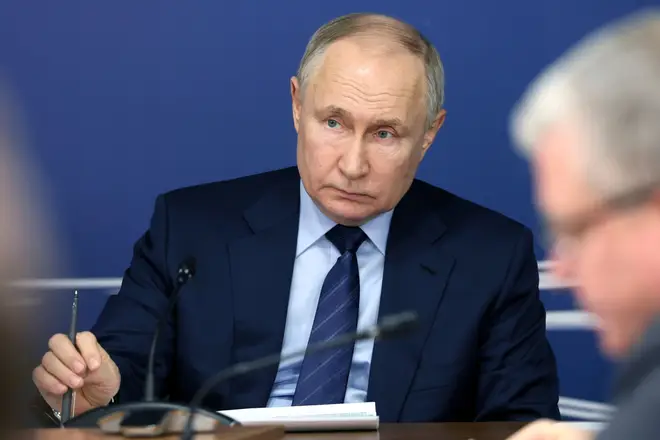 Russian President Vladimir Putin attends a meeting on the implementation of the high speed