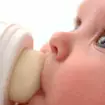 Baby drinking infant formula from bottle (PA)