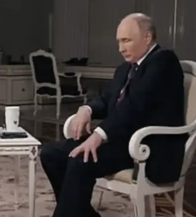 Putin was seen holding down his leg during a speech to Tucker Carlson