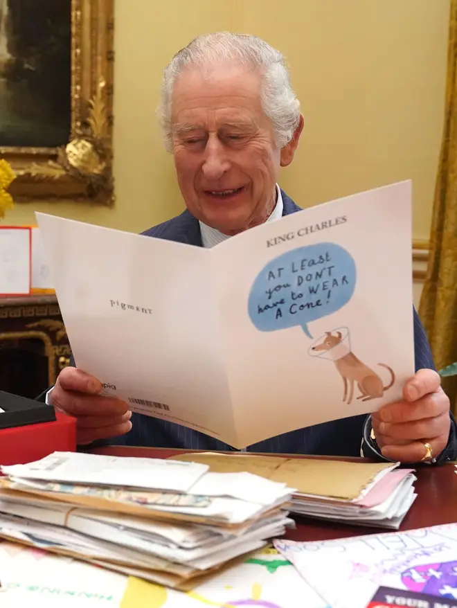 King Charles III reads cards and messages, sent by well-wishers
