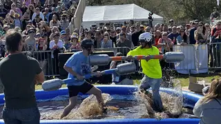 Competitors battle in a muddy pool at the Florida Man Games