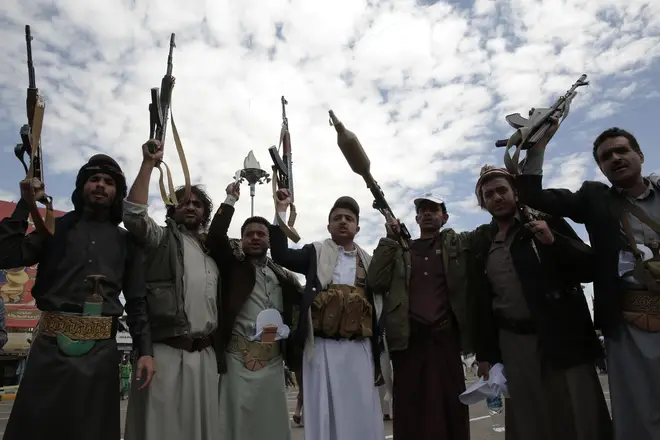 Armed supporters of Yemen's Houthi followers take part in a pro-Palestinian protest