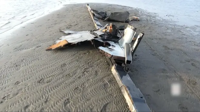 A screenshot captured from a video released by the Houthi group on February 20, 2024 shows the wreckage of a U.S. MQ9 drone on a beach in Hodeidah, western Yemen