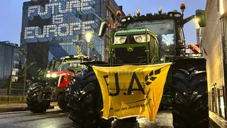 A protest by farmers outside a meeting of EU agriculture ministers in Brussels