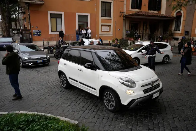 The car carrying Pope Francis leaves the Gemelli Isola Tiberina Hospital in Rome