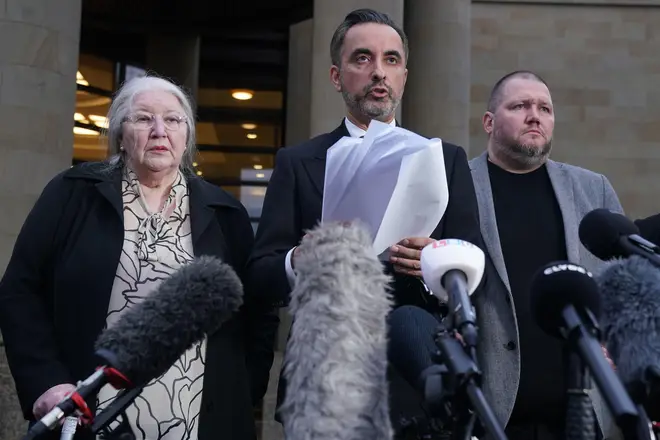 Solicitor Aamer Anwar, beside mother Margaret Caldwell and other family members, reads out a statement