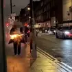 The man rushed down the street in West London on fire before bystanders managed to extinguish the flames
