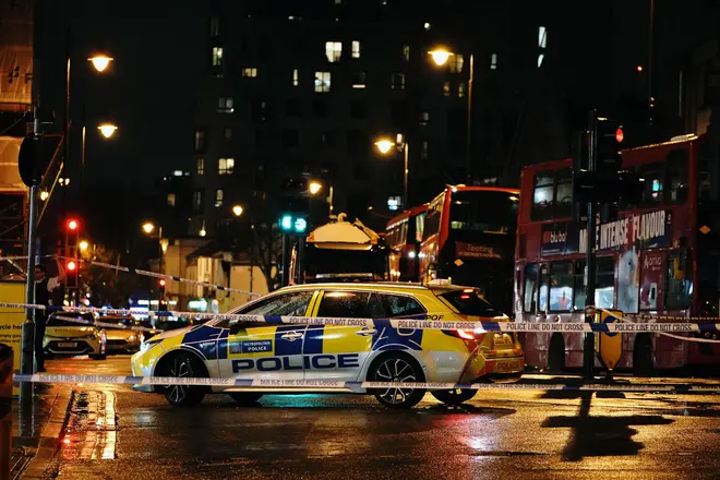 Police at the scene of a shooting in Clapham