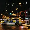 Police at the scene of a shooting in Clapham