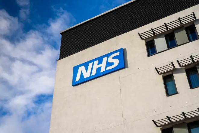 View of the NHS (National Health Service)  logo  on a modern building. *EDITORIAL ONLY*