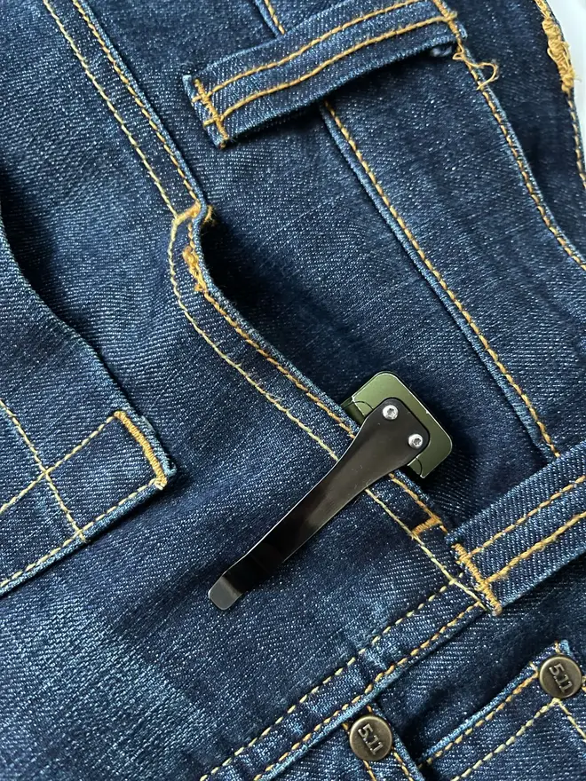 The original Olight Arkfeld (featuring a pair of 5.11 jeans)