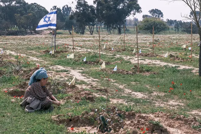 A woman grieves for victims of the October 7th, 2023, Nova Music Festival Massacre near Kibbutz Reim
