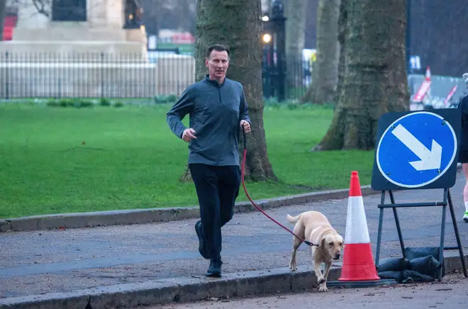 Chancellor of the Exchequer Jeremy Hunt out jogging in Westminster the day before the Budget