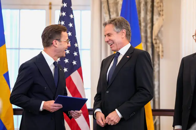 Secretary of State Antony Blinken stands with Swedish Prime Minister Ulf Kristersson before presenting Sweden's NATO Instruments of Accession, Thursday