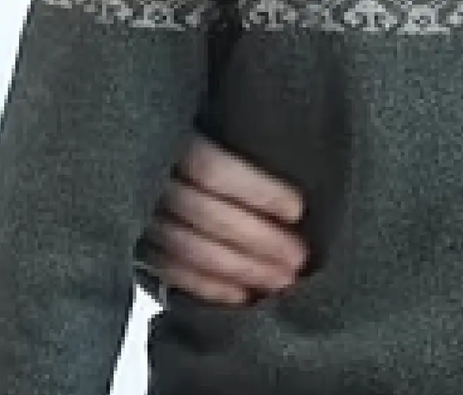 Kate's blurred hand.