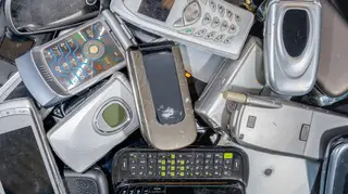 A pile of old cell phones to be recycled