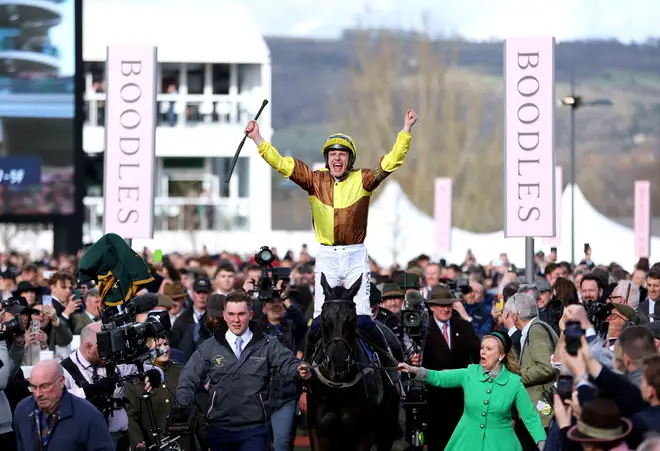 Jockey Paul Townend celebrates on Galopin Des Champs after winning the 2023 Cheltenham Gold Cup