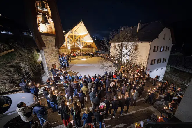 Swiss locals held a memorial precession on Monday.