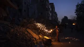 A boy plays with fireworks