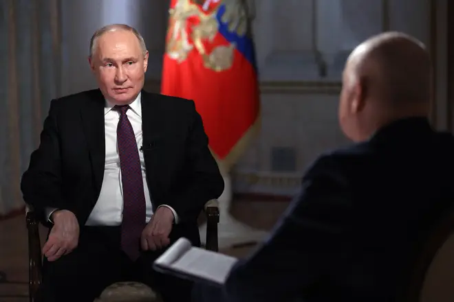Russian President Vladimir Putin gives an interview at the Kremlin