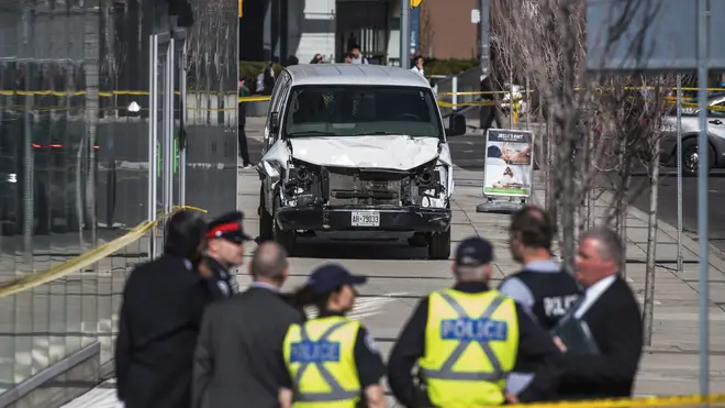A police cordon around a damaged van in Toronto.