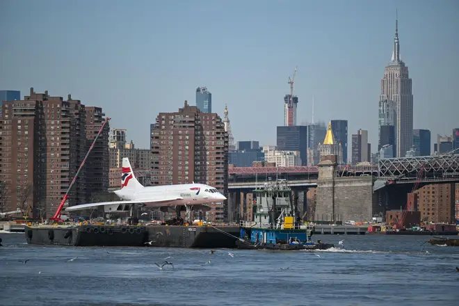 The Intrepid Museum's British Airways Concorde rides on a barge down the East River in New York