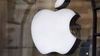 Apple logo in window of store