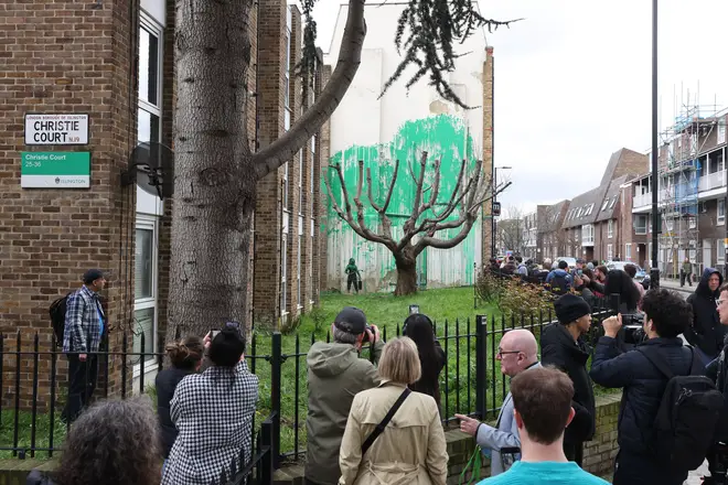 Visitors have been gathering in Hornsey Street, near Finsbury Park, north London, to see Banksy's new mural.
