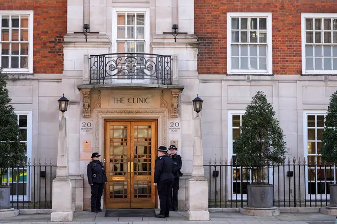 Police officers stand outside an entrance to The London Clinic in London, January 26, 2024