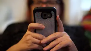 File photo dated 08/05/19 of a woman using her mobile phone.