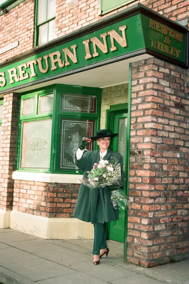 Julie Goodyear is pictured outside The Rovers Return on the set of 'Coronation Street'