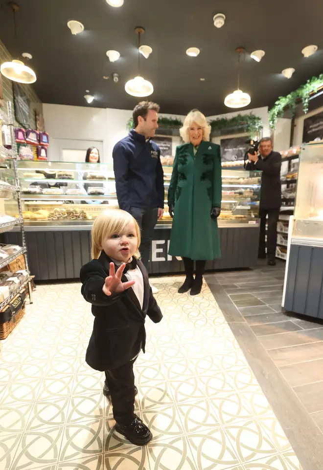 Queen Camilla meets the owner of Knotts Bakery, William Corrie with his son Fitz