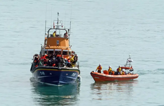 A group of people thought to be migrants are brought in to Dover onboard the RNLI Dover Lifeboat