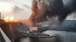 Smoke and fire rise over the Dnipro hydroelectric power plant after Russian attacks in Dnipro, Ukraine