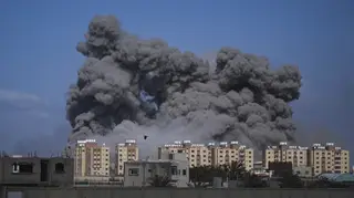 Smoke rises following an Israeli air strike in the central Gaza Strip