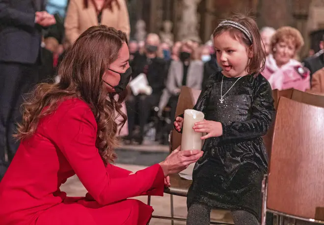 Princess Kate talks to Mila Sneddon, 6, ahead of the Together At Christmas community carol service at Westminster Abbey, London, 2021