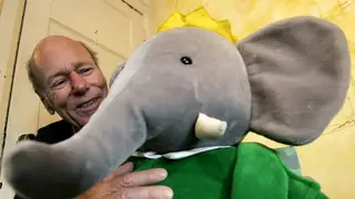 Author Laurent de Brunhoff with a Babar cuddly toy