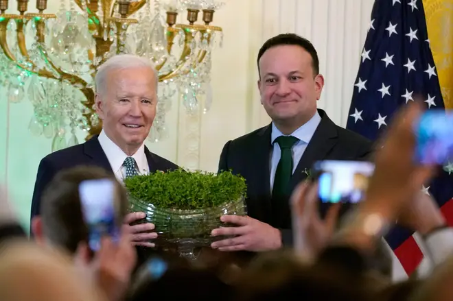 Ireland's Prime Minister Leo Varadkar presents President Joe Biden with a bowl of Shamrocks during a St. Patrick's Day reception, March 17