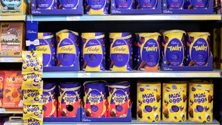 UK supermarket shelves filled with Cadbury Easter Eggs. The assortment includes Cadury Flake, Twirl Creme egg and mini Eggs