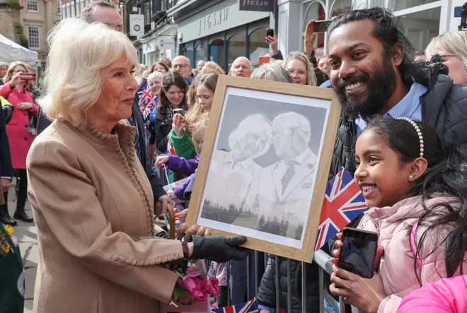 Camilla admires an artwork of her with King Charles