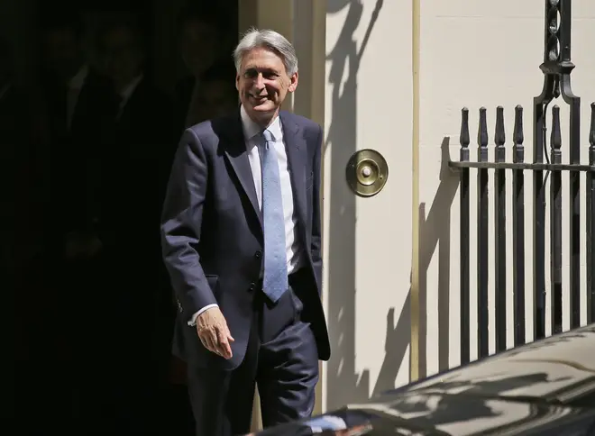 Philip Hammond leaves Downing Street on Wednesday
