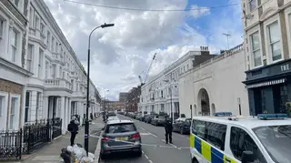 Police at the scene of the shooting in Comeragh Road, West Kensington