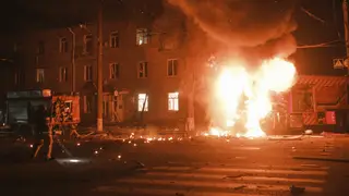 A fire engine on fire after Russian drone strikes on a residential neighbourhood in Kharkiv, Ukraine
