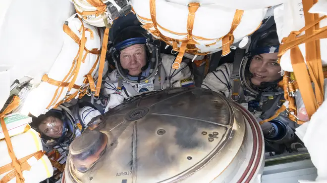 Nasa’s Loral O’Hara, left, Russia's Oleg Novitsky and Belarus spaceflight participant Marina Vasilevskaya, right, are seen inside the Soyuz MS-24 spacecraft after they landed in a remote area in Kazak