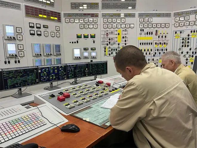Ukrainian workers at their positions in the control room of the Zaporizhzhia Nuclear Power Plant.